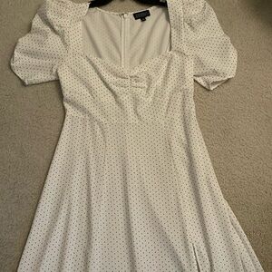 The white dress with polka dots, it was worn couple times, good condition.